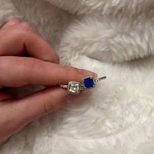 Clear and blue sparkle halo ring